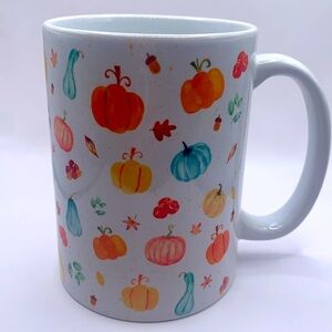 Pumpkin coffee mug. Ceramic large mug with pumpkins and leaves. Fall holiday.